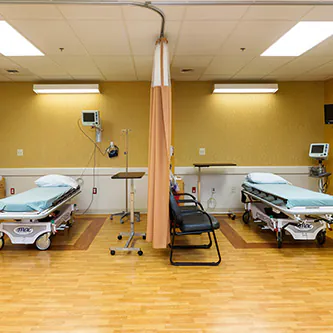 Pre-op and recovery area with two curtained stretcher bays at the Malvern surgery center