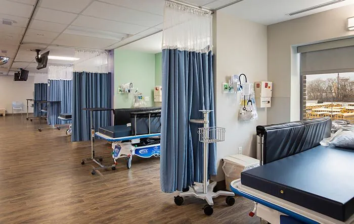 Pre-op and recovery area with curtained bays at the Philadelphia surgery center